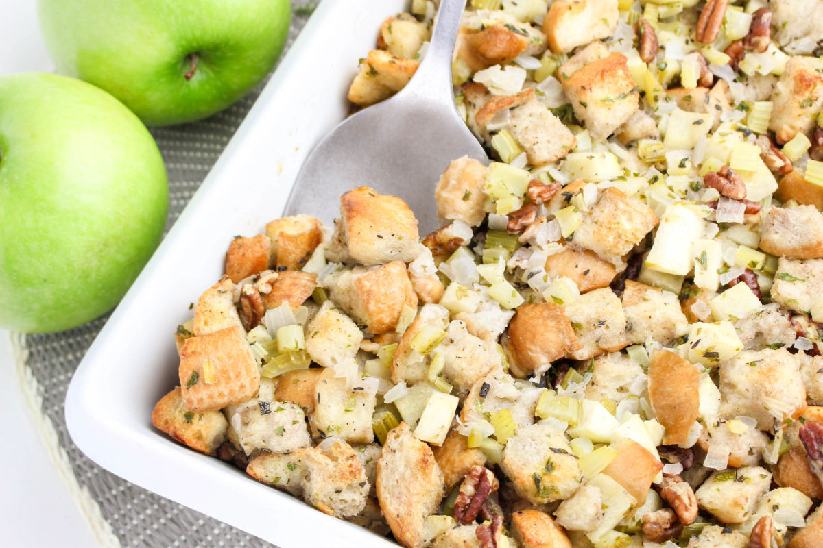 Bread cubes stuffing with herbs and diced celery, apples and pecans.