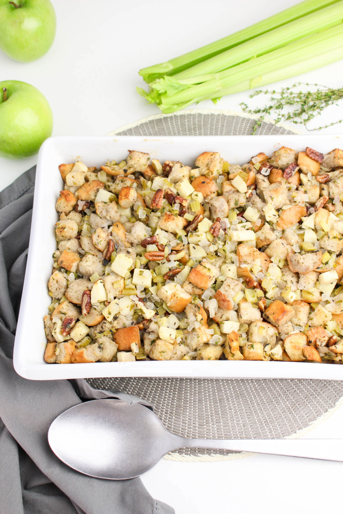 Overhead view of apple stuffing with green apples and celery on the side.