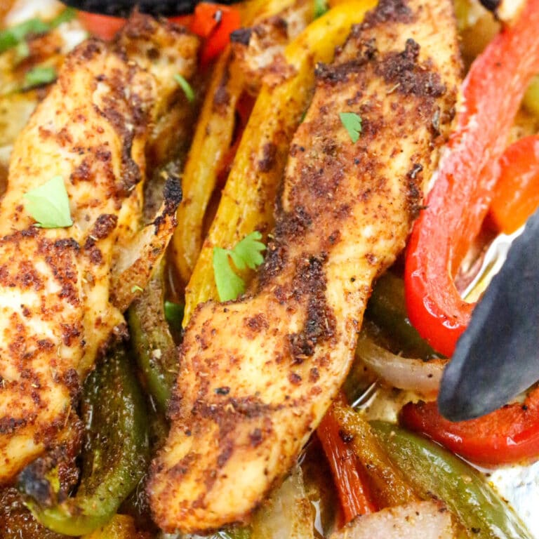 Baked chicken fajitas with bell peppers.