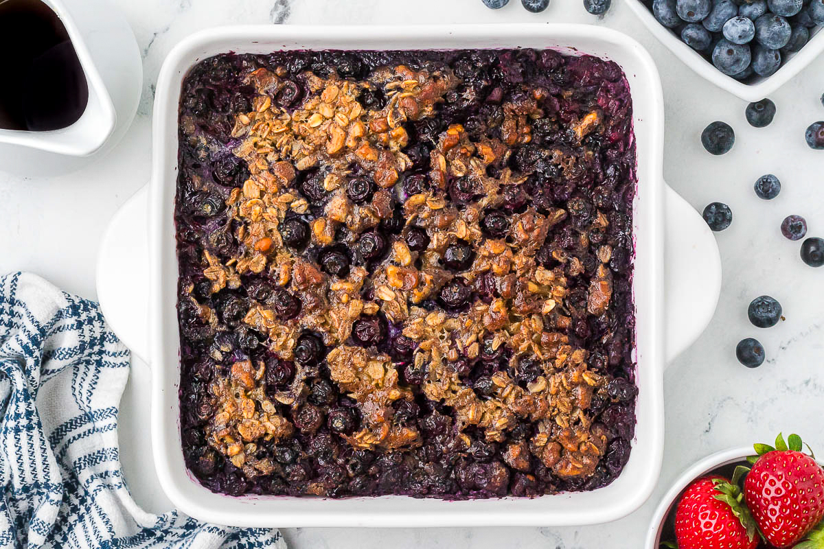 Cooked oatmeal baked in a white 8x8-inch pan.