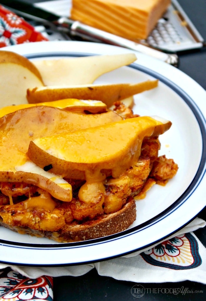Open Faced Cauliflower Cheddar Melt with slices of pears and honey mustard! This hearty and satisfy vegetarian sandwich is a great meatless Monday meal! The Foodie Affair
