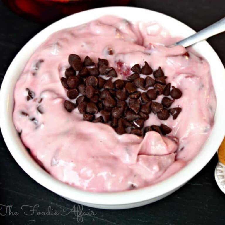 Cherry dip with chocolate chips in a white serving dish.