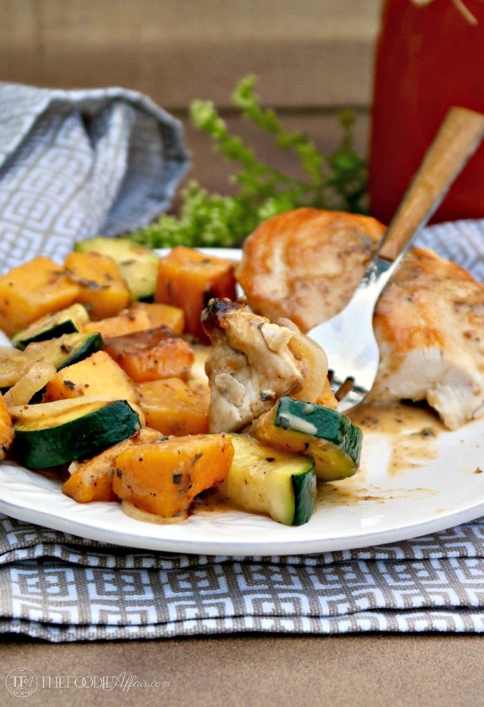 Chicken and butternut squash on a white dinner plate