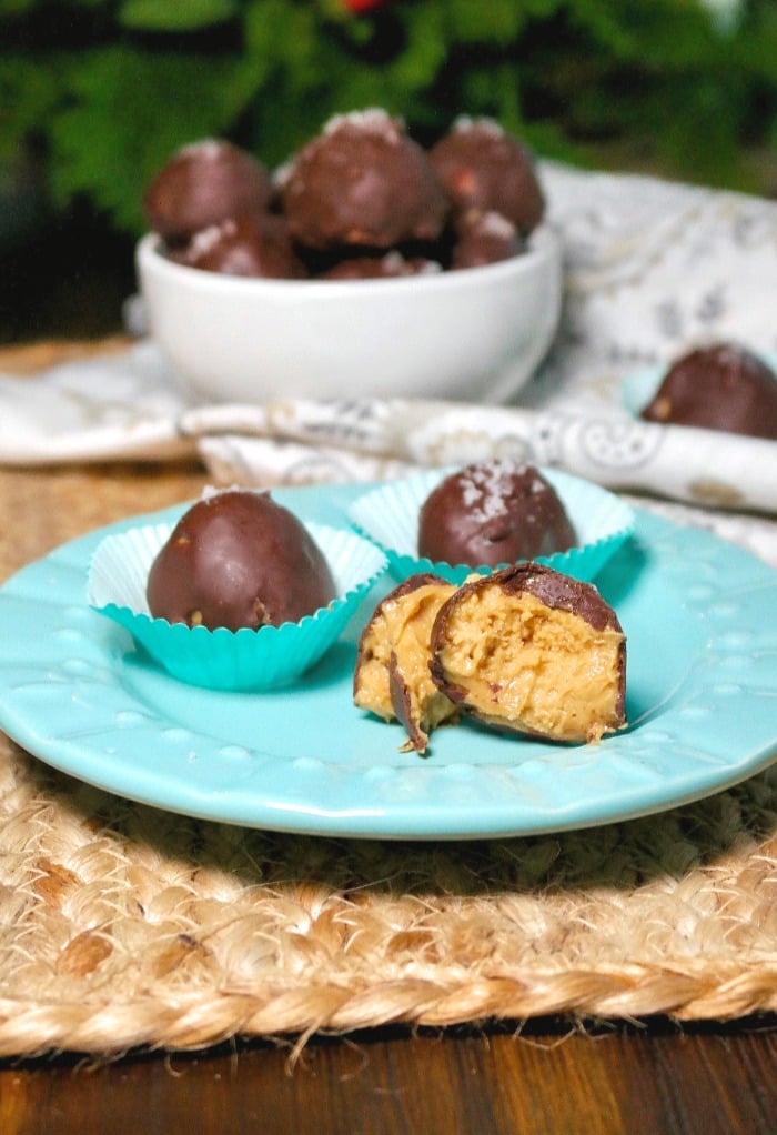 Chocolate peanut butter fat bombs on a teal plate