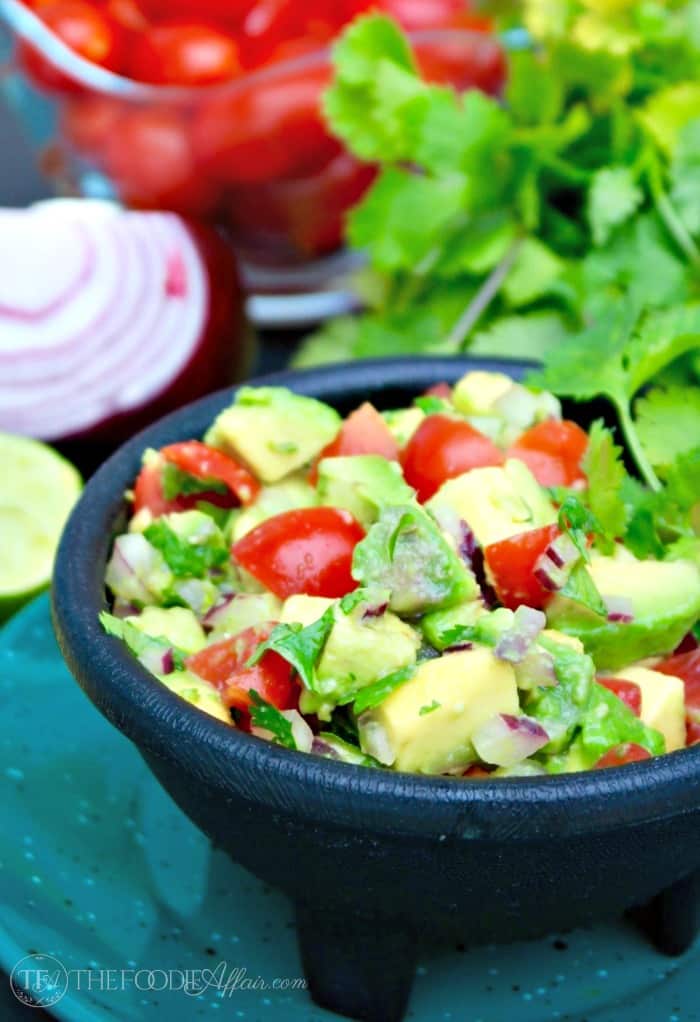 This simple Chunky Avocado Dip can be eaten with chips or served over a variety of dishes adding a healthy layer of fresh ingredients! The Foodie Affair
