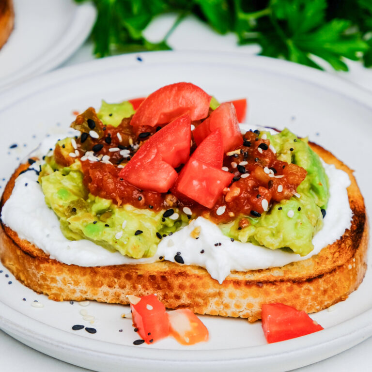 Sourdough toast topped with whipped cottage cheese and avocado.