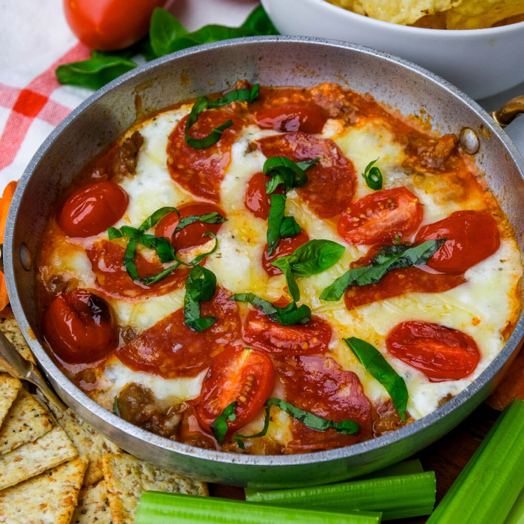 Melted cottage cheese mixed with cheese baked in a stainless steel bowl.
