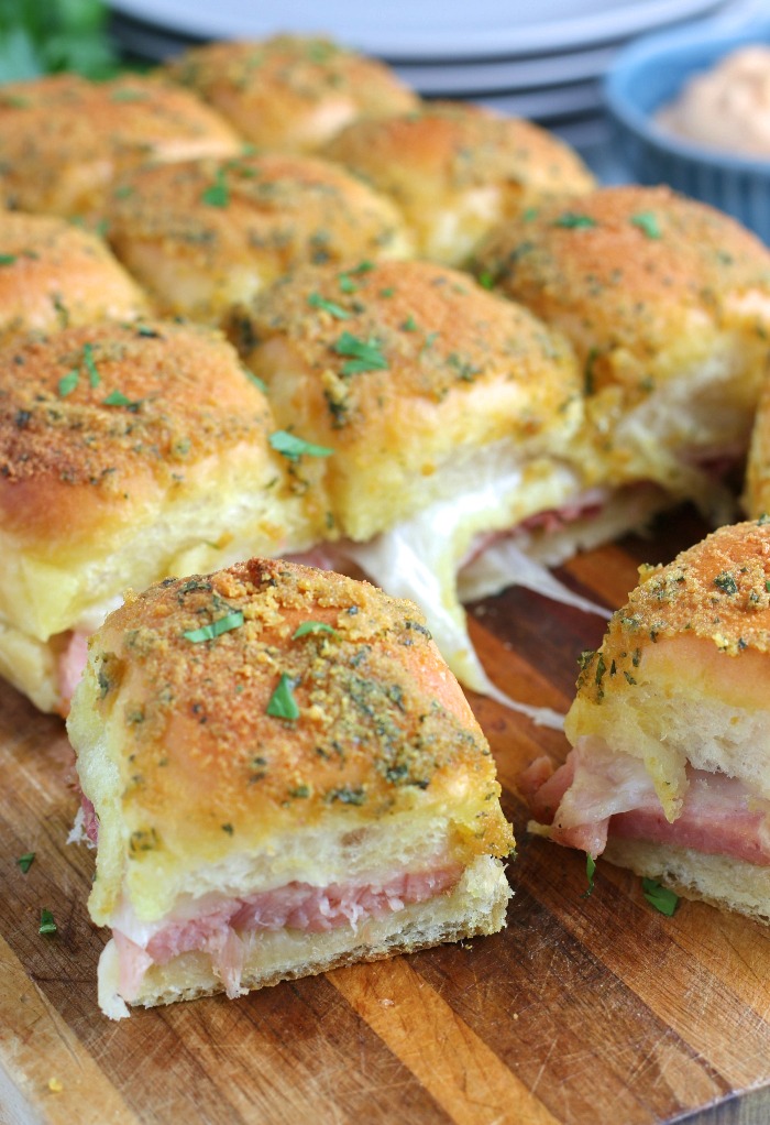A side view of the finished recipe for ham sliders shows off the delicious layers of this incredibly simple recipe.