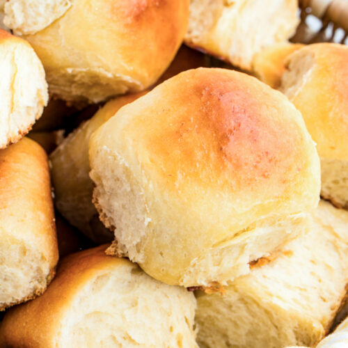 Homemade Hawaiian dinner rolls in a basket before eating.