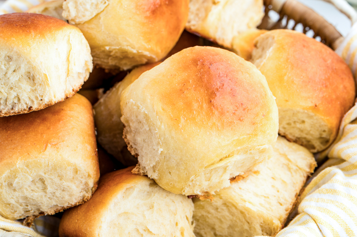 Homemade Hawaiian dinner rolls in a basket before eating.