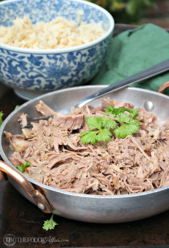Kalua Pork shredded in a silver serving plate