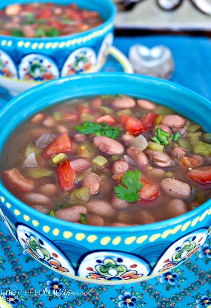Mexican pinto beans crock pot in a teal bowl