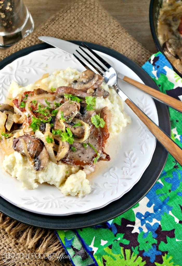 Pork Chops Mushroom Cream Sauce served over mock cauliflower mashed potatoes for a low carb easy skillet meal! #lowcarb #pork #sauce #mushrooms | www.thefoodieaffair.com
