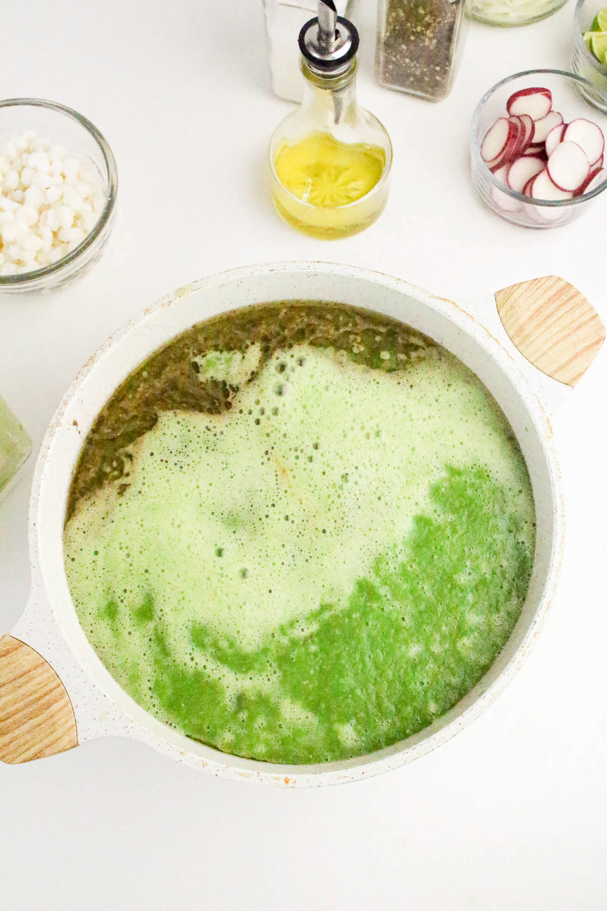 Green sauce added to soup mix.