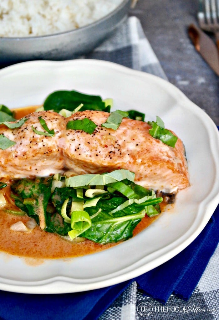 Salmon Coconut Red Curry Sauce over sautéed greens #keto #salmon #coconut | www.thefoodieaffair.com