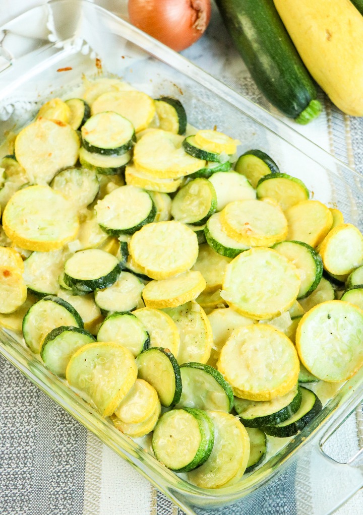 Sliced zucchini in a clear baking dish ready to be served.
